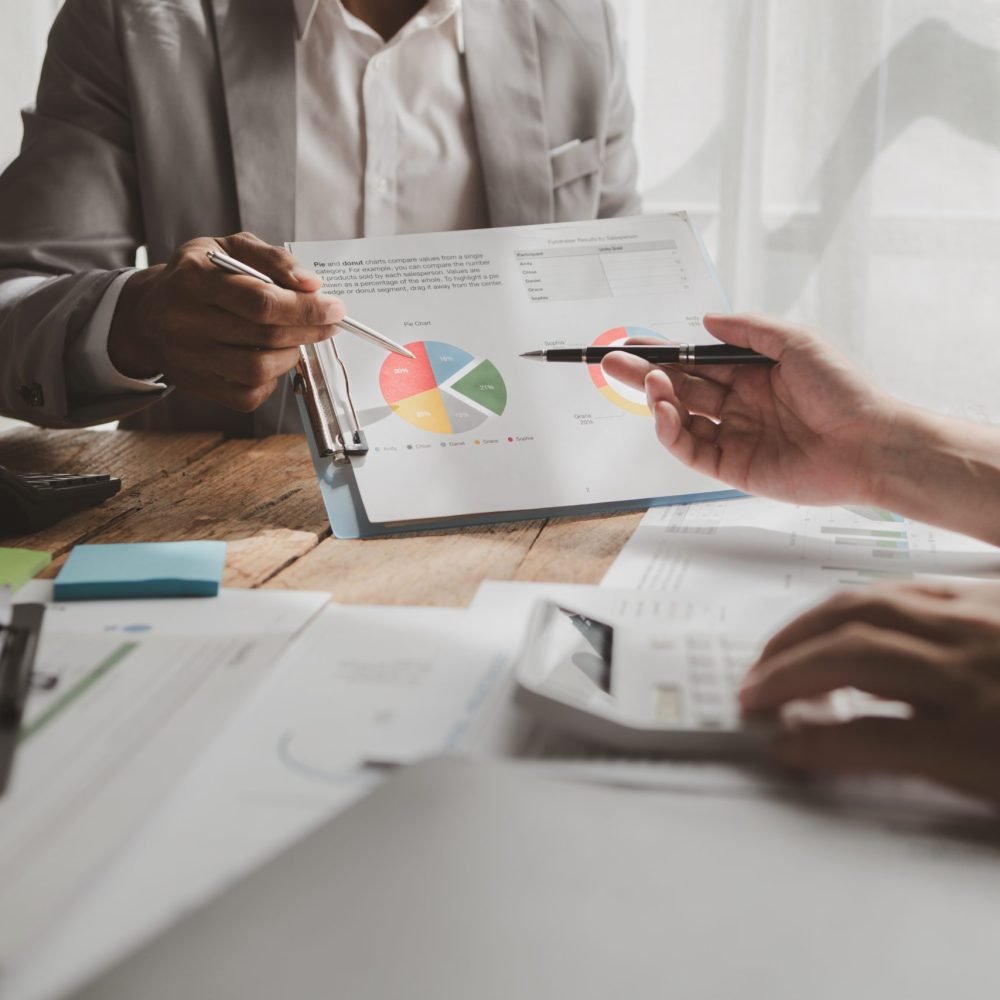 They are planning finances for expenses within the company, Meeting on reporting tax payments, Calculate the numbers according to the report sent to the meeting, finances idea.